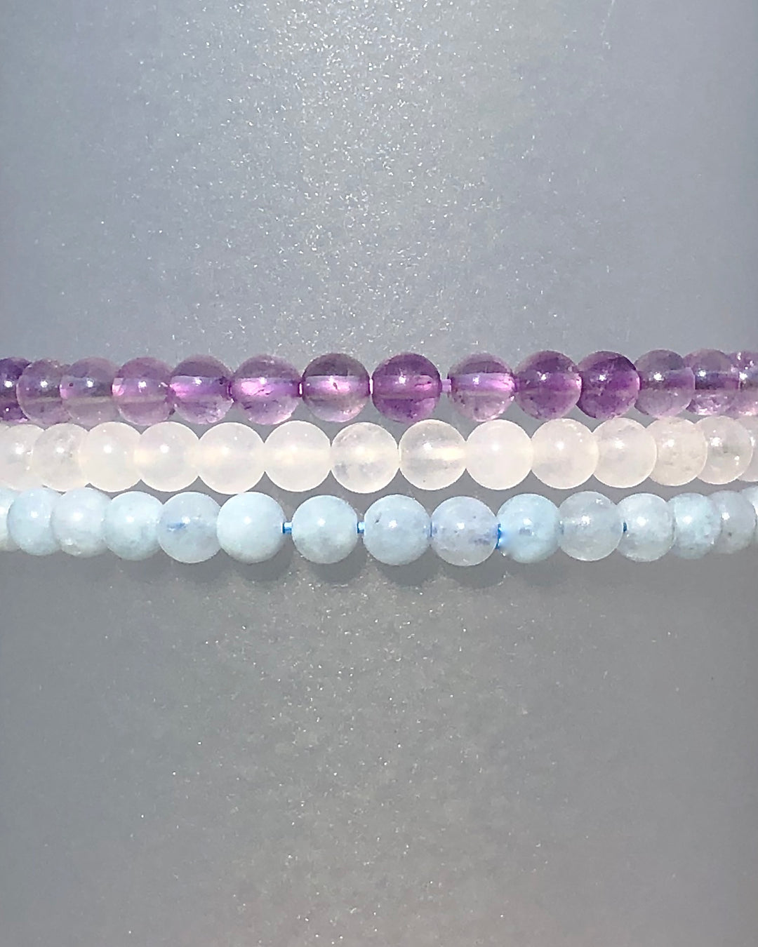 Lavender Amethyst, Snow Quartz and Aquamarine crystal Bracelets. 