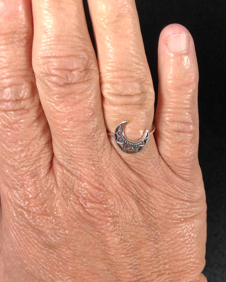 Silver Crescent Moon Ring on ring finger