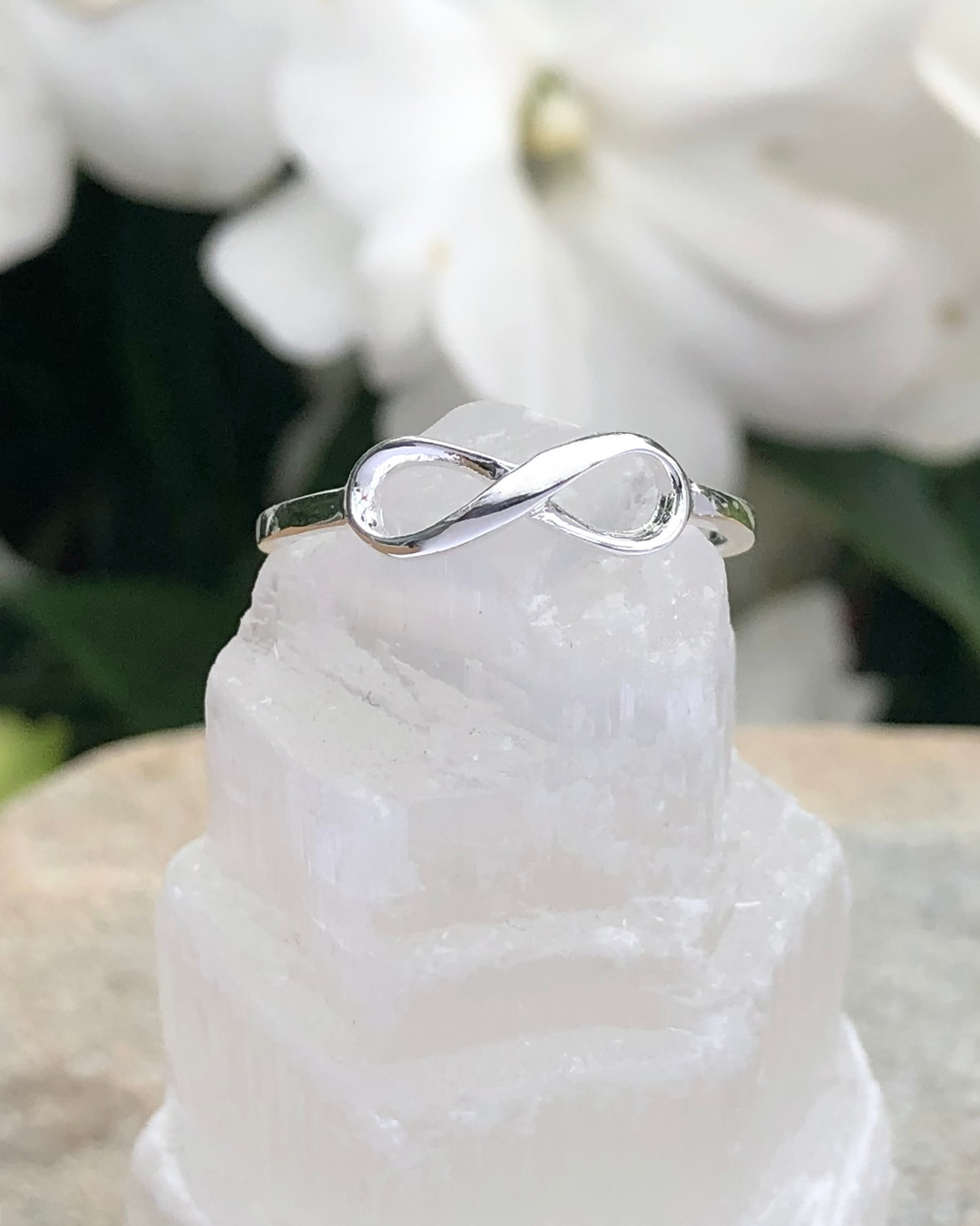 Silver Infinity Ring on selenite stone 