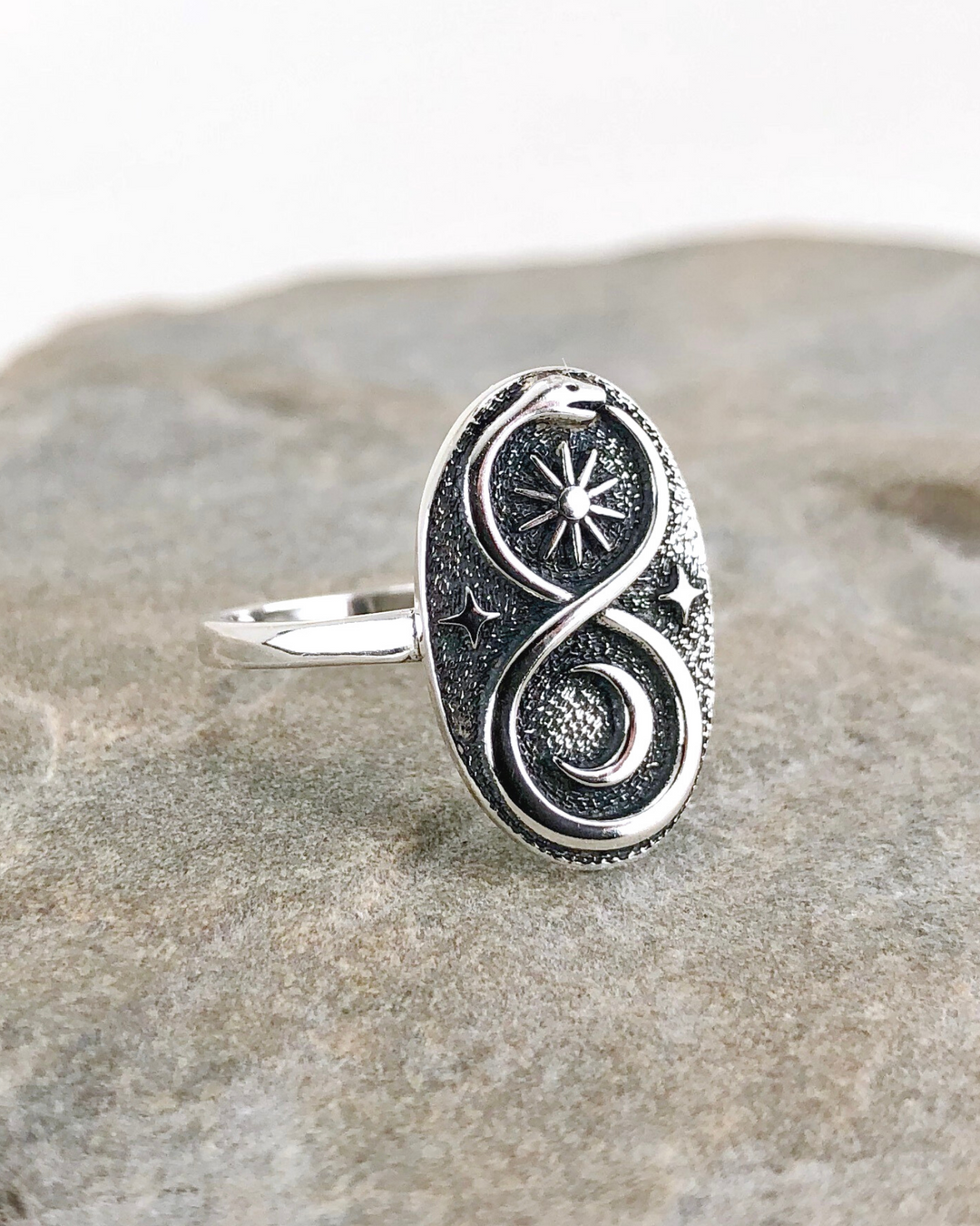 Sterling Silver Ouroboros Ring on stone