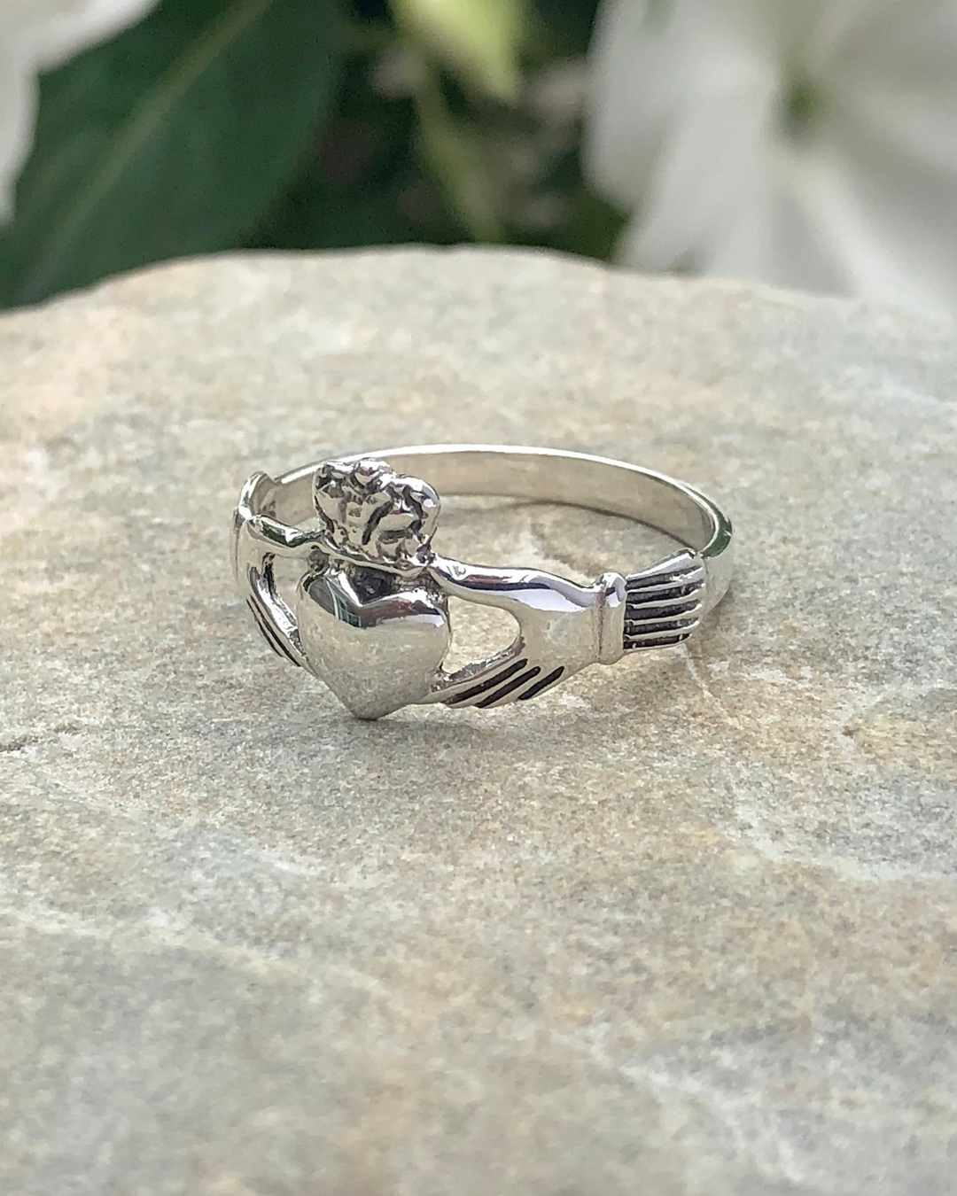 Sterling Silver Claddagh Ring on stone side view