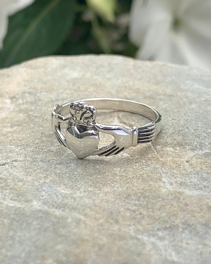 Sterling Silver Claddagh Ring on stone side view