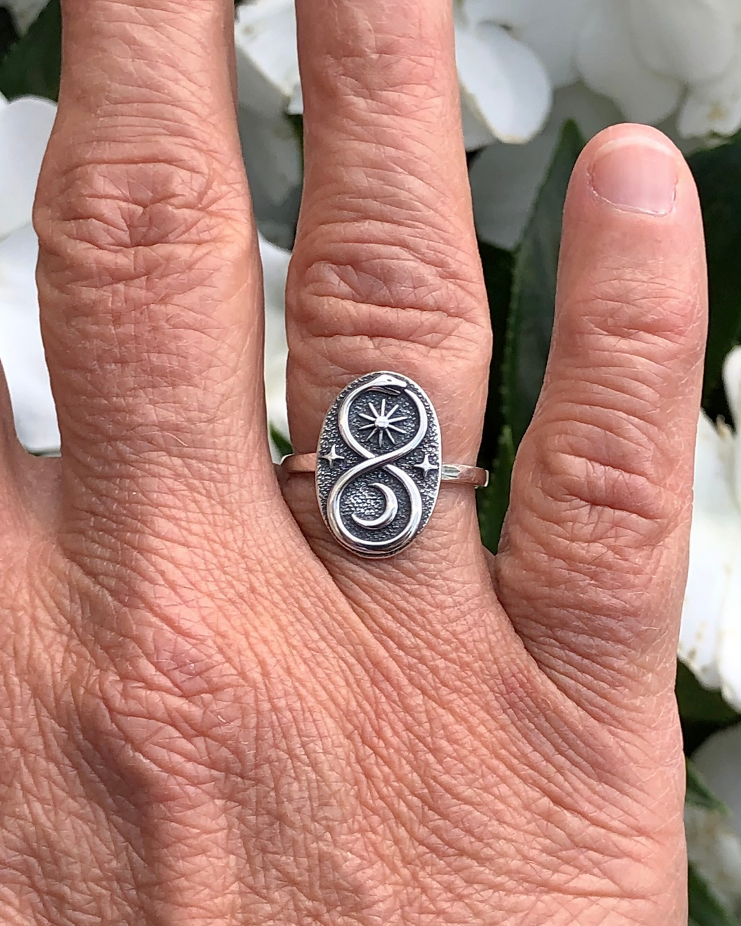 Sterling Silver Ouroboros Ring on finger close up