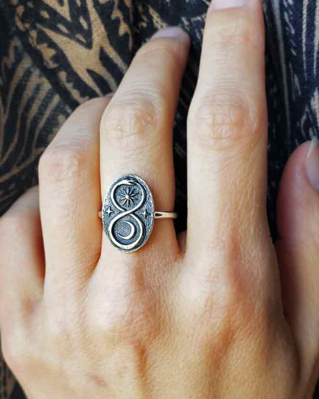 Sterling Silver Ouroboros Ring on middle finger