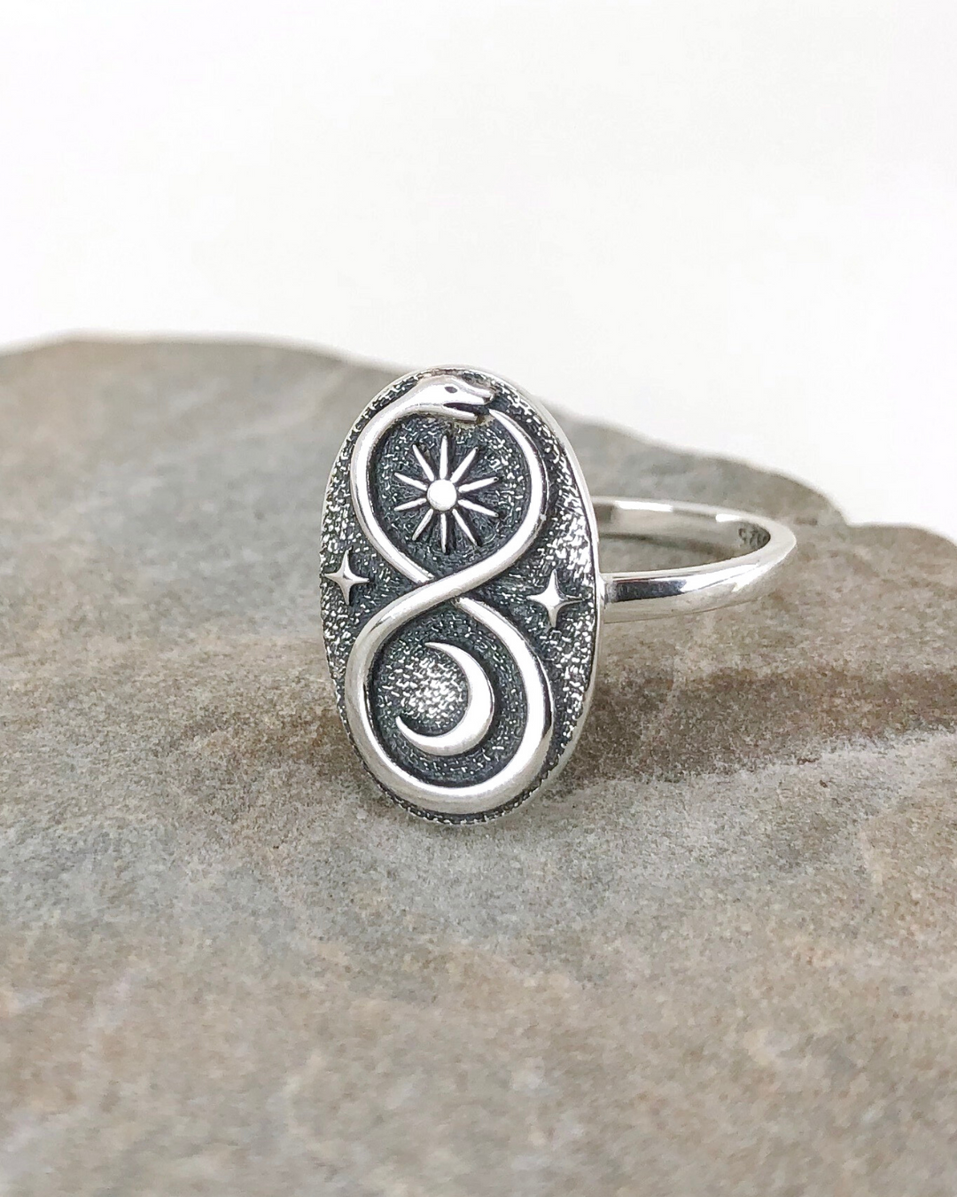 Sterling Silver Ouroboros Ring on stone