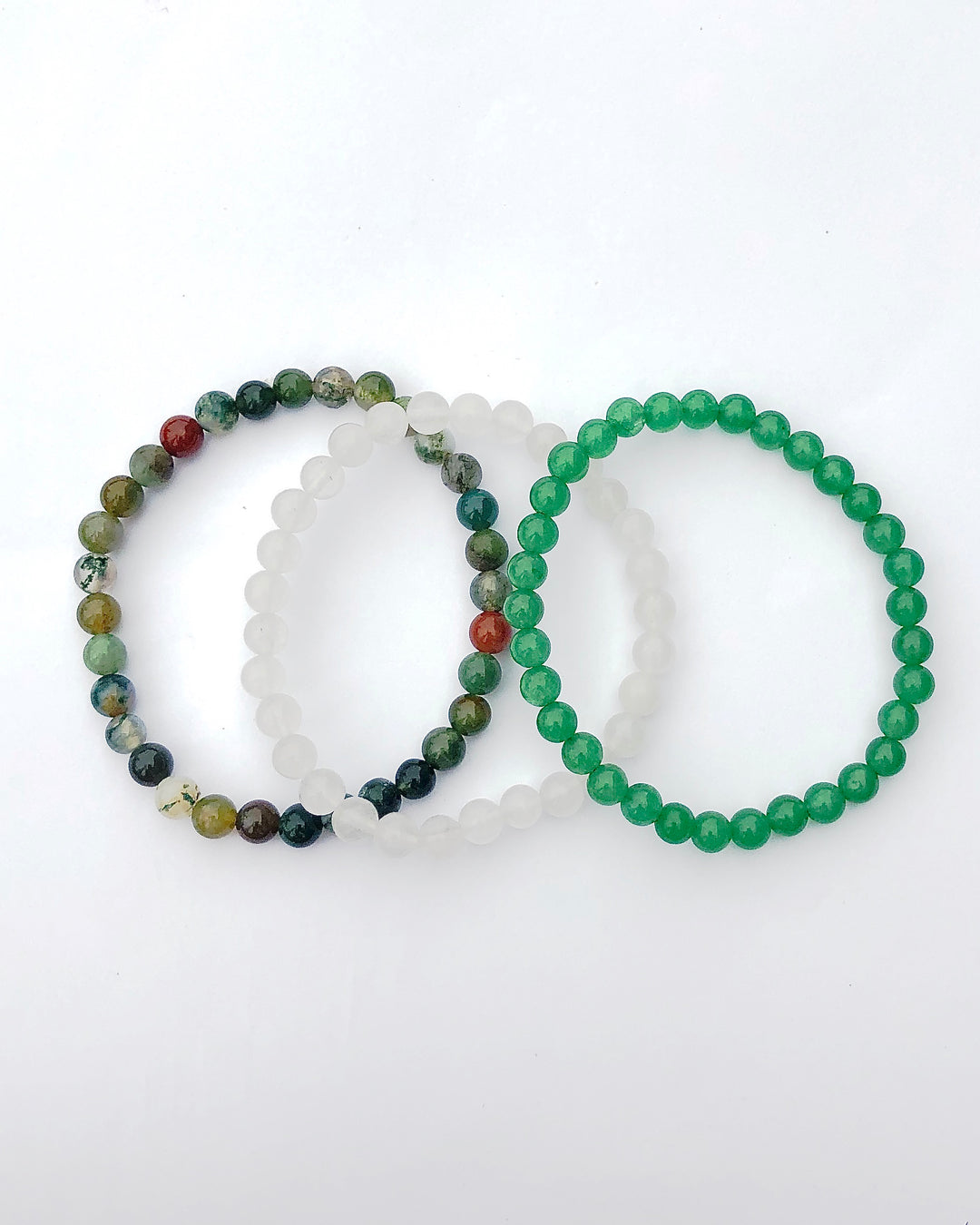 Aventurine, Snow Quartz and Indian Agate 6mm Beaded Gemstone Bracelet Set for Support and Grounding on a white background