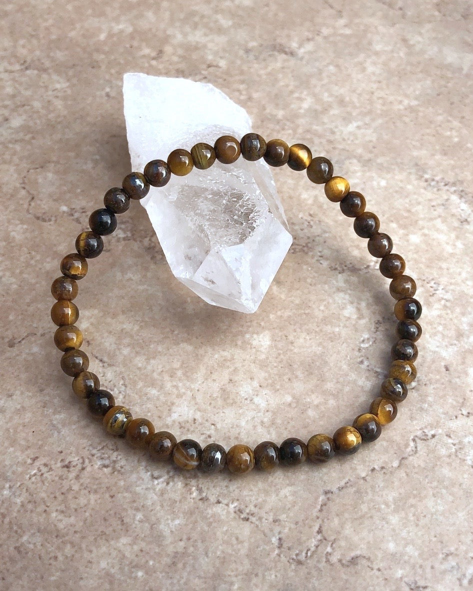 Tiger Eye 4mm Beaded Gemstone Bracelet on a crystal