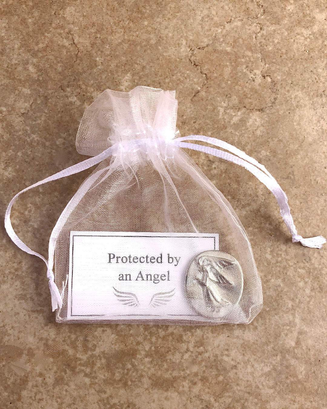 pewter pocket angel in white organza pouch with protected by an angel card